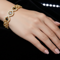 Luxurious Gold Crystal & Black Quatrefoil Statement Bangle